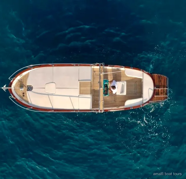 Private Amalfi Coast boat tour guests swimming near the Emerald Grotto